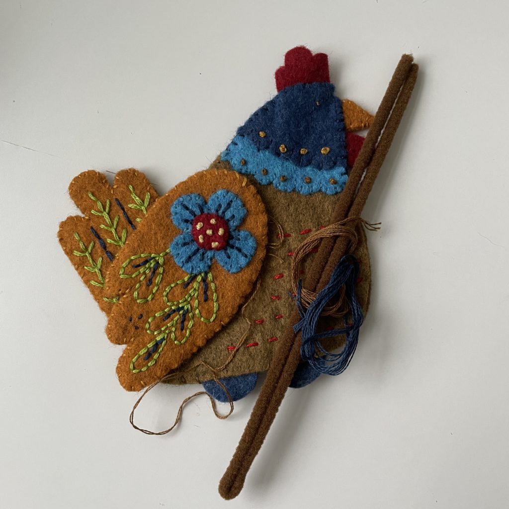 Embroidered felt French hen ornament.
